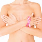 health, medicine, beauty concept - naked woman with breast cancer awareness ribbon